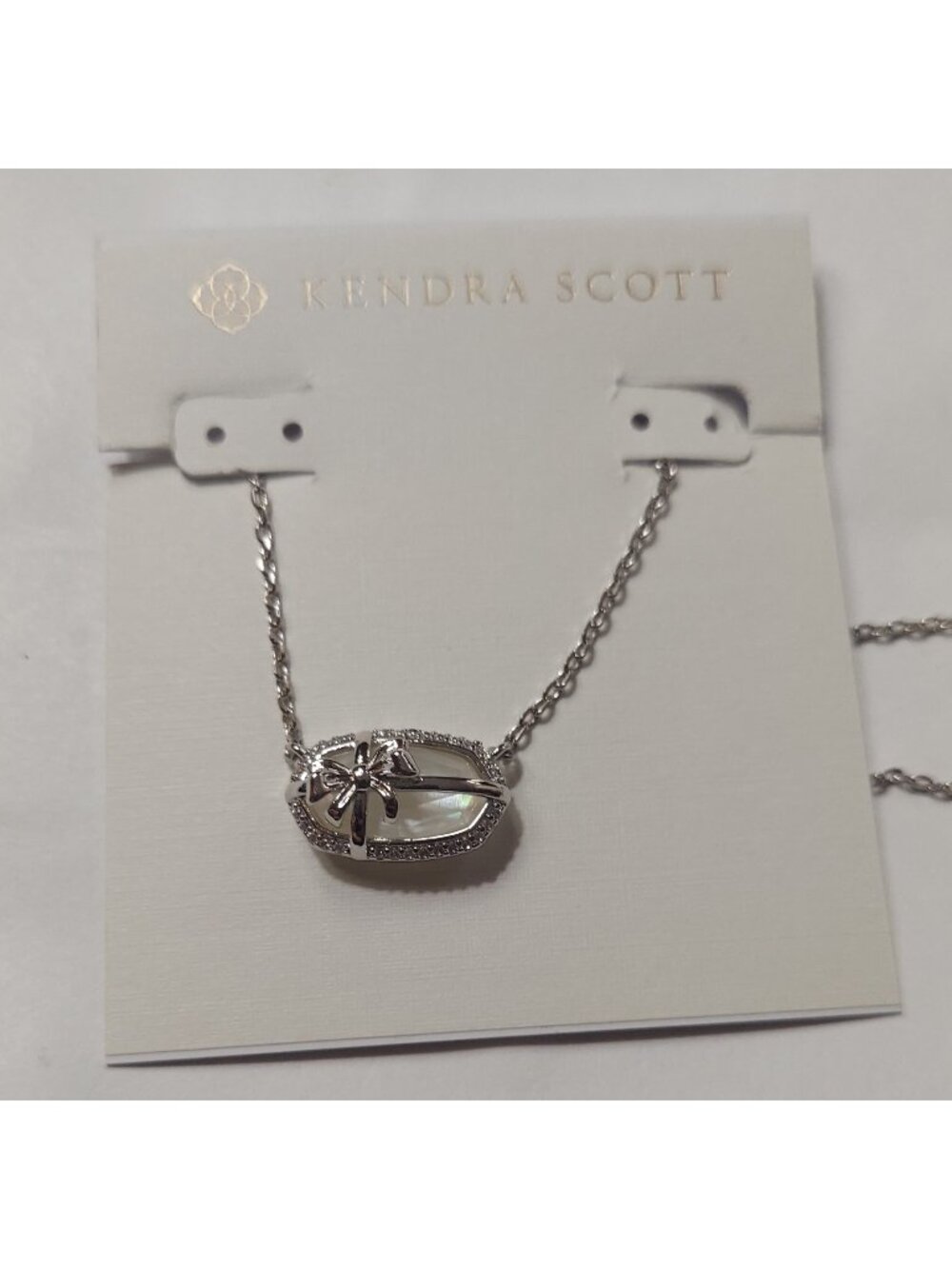 Kendra Scott Elisa Bow silver short pendant necklace.